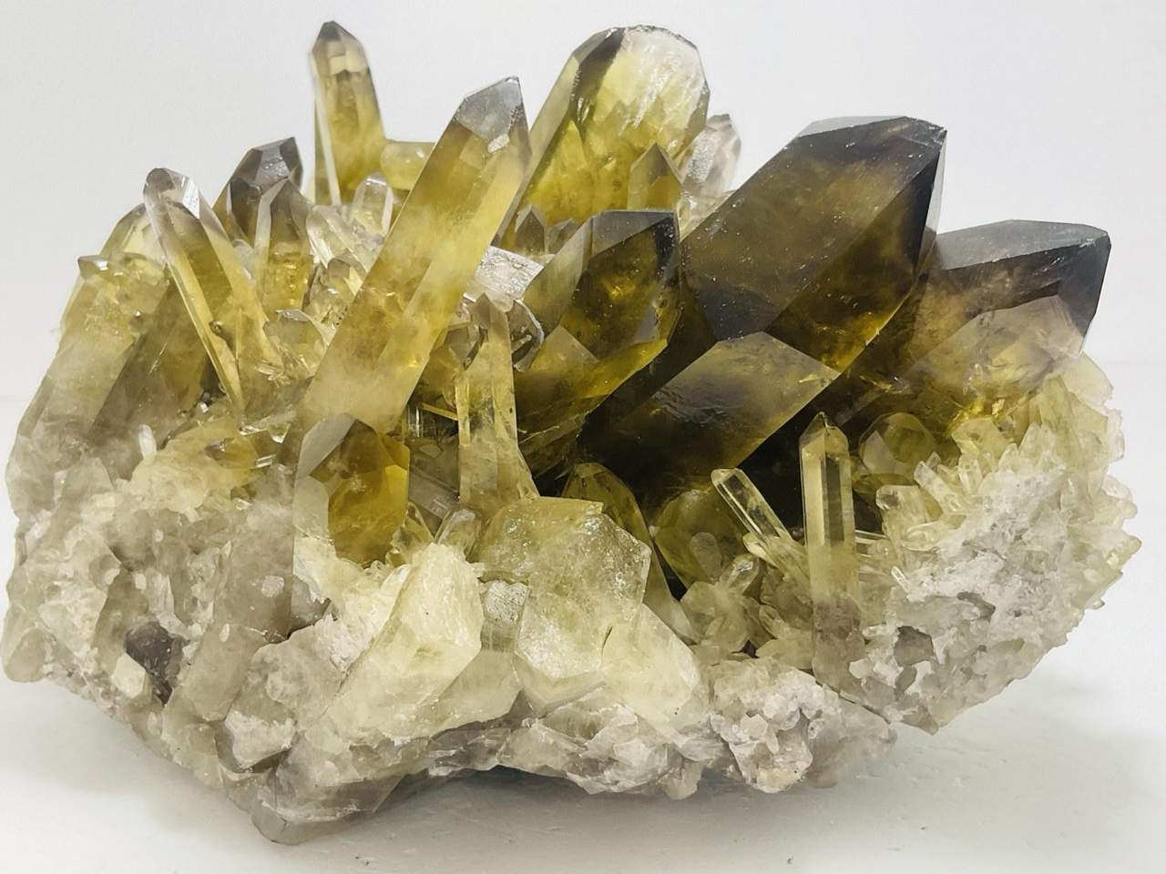 Yellow and smoky crystal points on a pale matrix