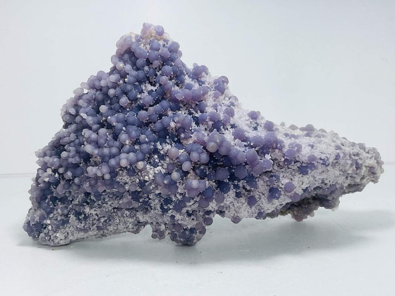 Pale violet crystal cluster against a light background
