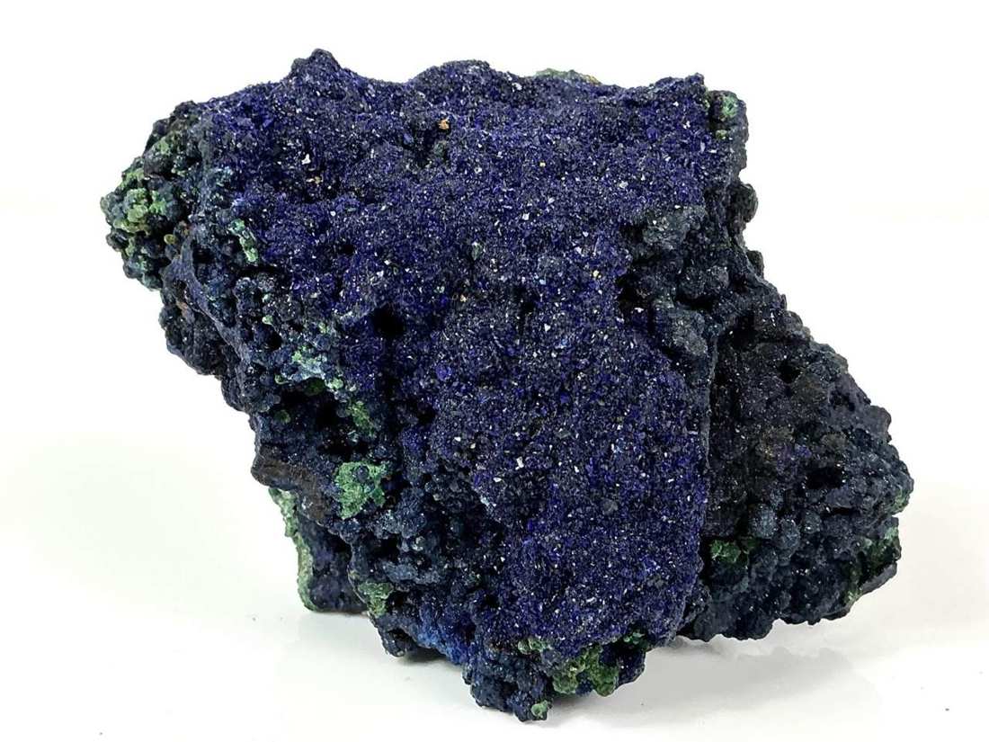 Broad sparkling Azurite surface with rounded growth and scattered green Malachite