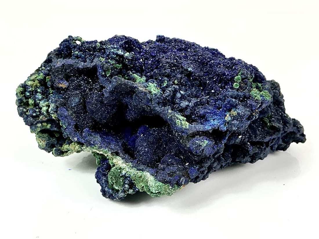 Side view showing open pockets and green Malachite along the Azurite edges