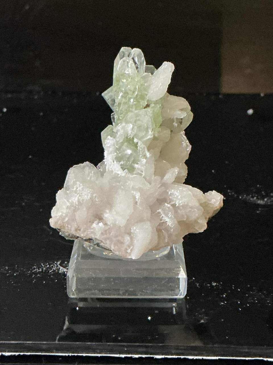 Pale green Apophyllite crystals with Calcite on basalt, Maharashtra, India