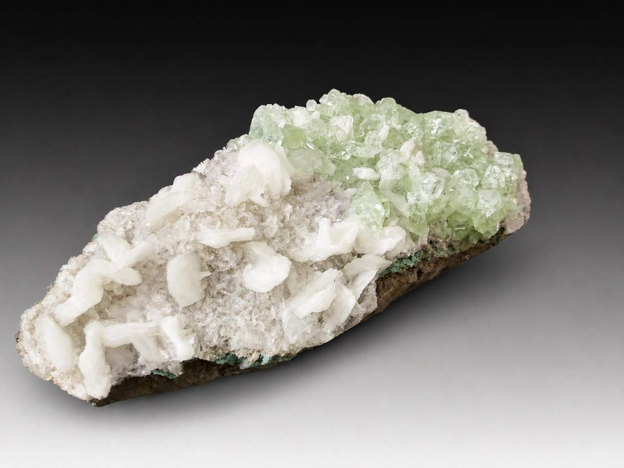 Green Apophyllite crystals and white Stilbite on elongated matrix, Maharashtra, India