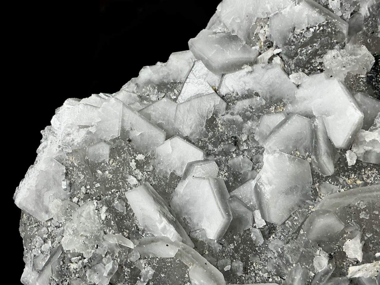 Close view of the white Calcite crystals and grey matrix